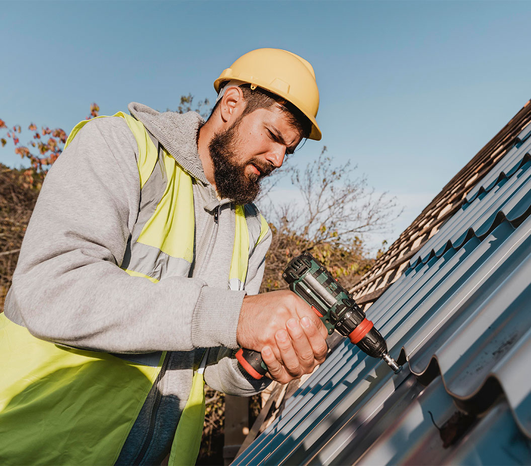 Kicoemg specialist installing a metal roof